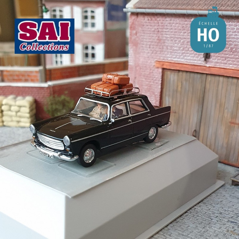 Peugeot 404 noire avec galerie de toit 3 valises un conducteur et un passager HO SAI 1823